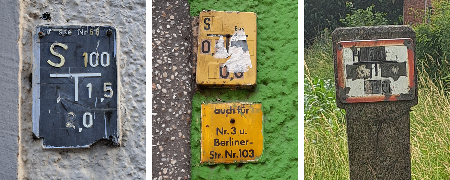 Drei beschädigte oder verdreckte Hinweisschilder